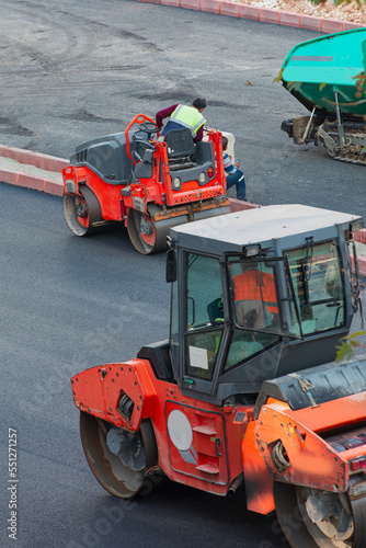 Road roller at construction site - Construction site is laying new asphalt road pavement © muratart