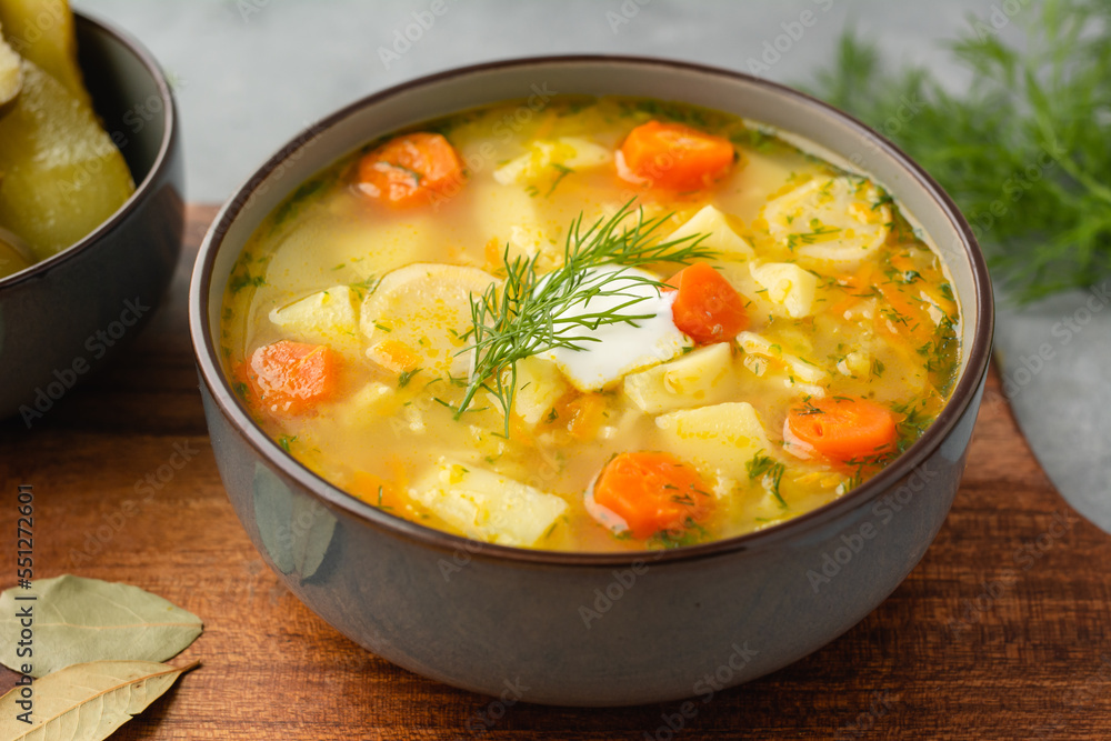 Cucumber soup - traditional Polish soup with pickled cucumbers, potatoes, carrots and dill Cucumber soup - traditional Polish soup with pickled cucumbers, potatoes, carrots and dill