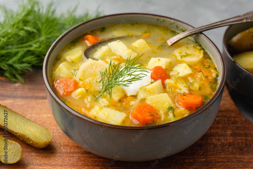 Cucumber soup - traditional Polish soup with pickled cucumbers, potatoes, carrots and dill Cucumber soup - traditional Polish soup with pickled cucumbers, potatoes, carrots and dill
