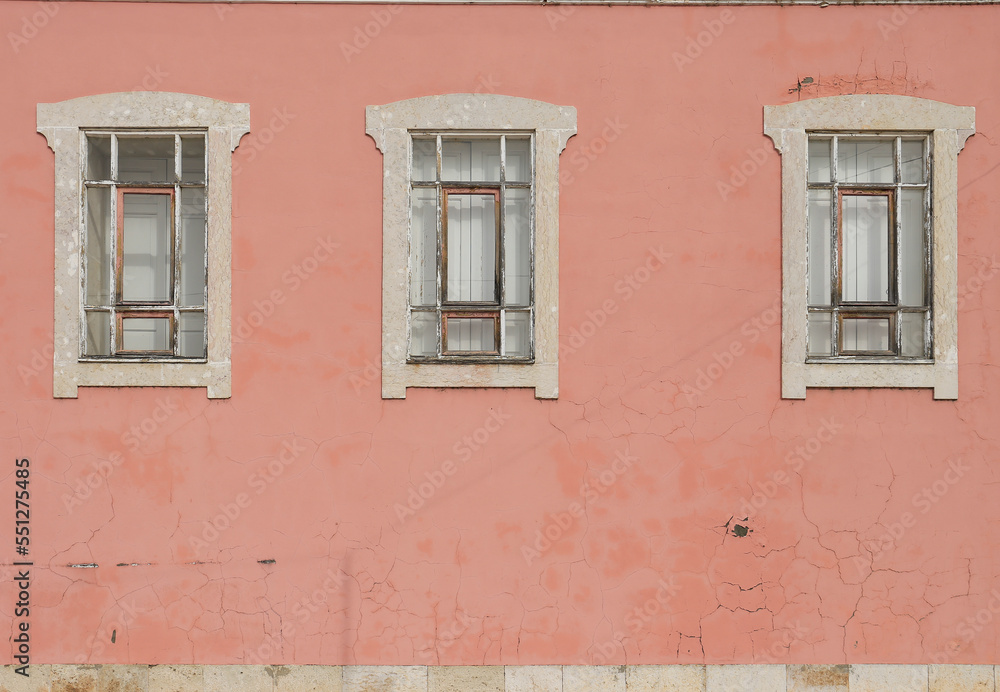 Beautiful pink facade in Portugal with white windows Beautiful pink facade in Portugal with white windows