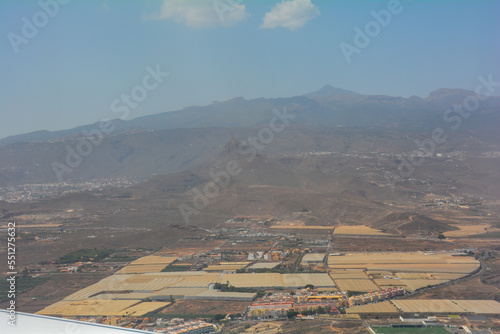 View from an airplane window during the landing approach over the island of Tenerife to Reina Sofía Airport photo