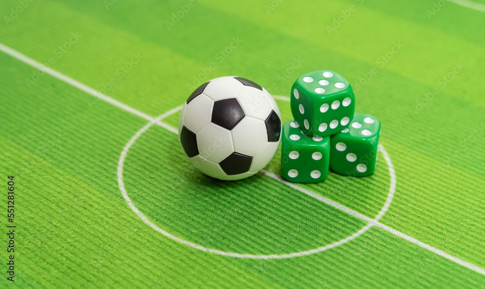 dice and soccer ball on green grass, football sports betting concept dice and soccer ball on green grass, football sports betting concept