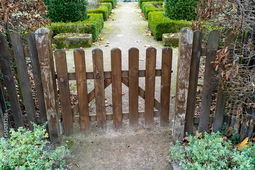 Fototapeta Naklejka Na Ścianę i Meble -  fence with wooden gate in a garden