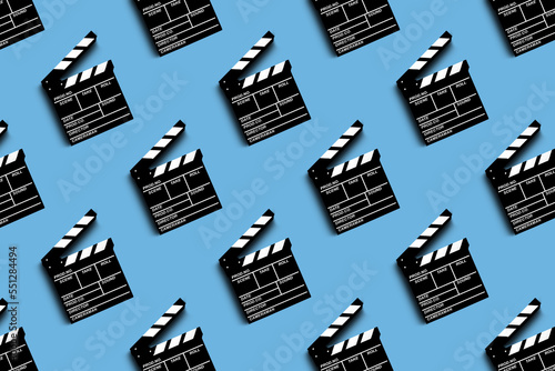 clapper board for shooting video and movies pattern on blue background photo