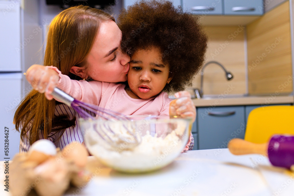 Fototapeta premium polyethnic family cooking biscuits, make breakfast at home together
