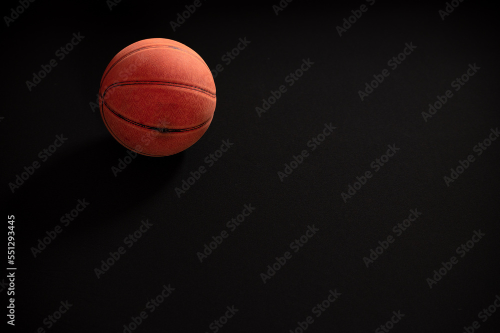 Basketball shot against black background Basketball shot against black background