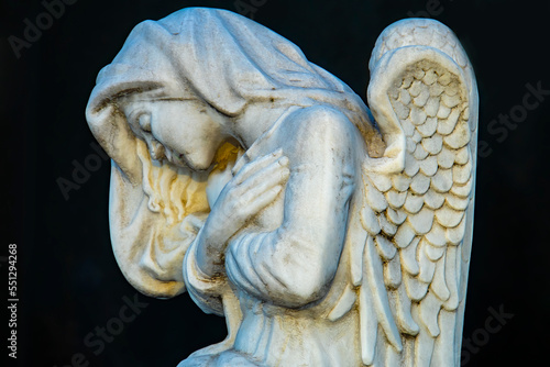 figure of an angel in a cemetery on an autumn day