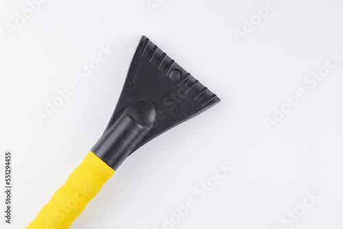 Car scraper brush to clean snow from windshield  remove ice isolated on white background