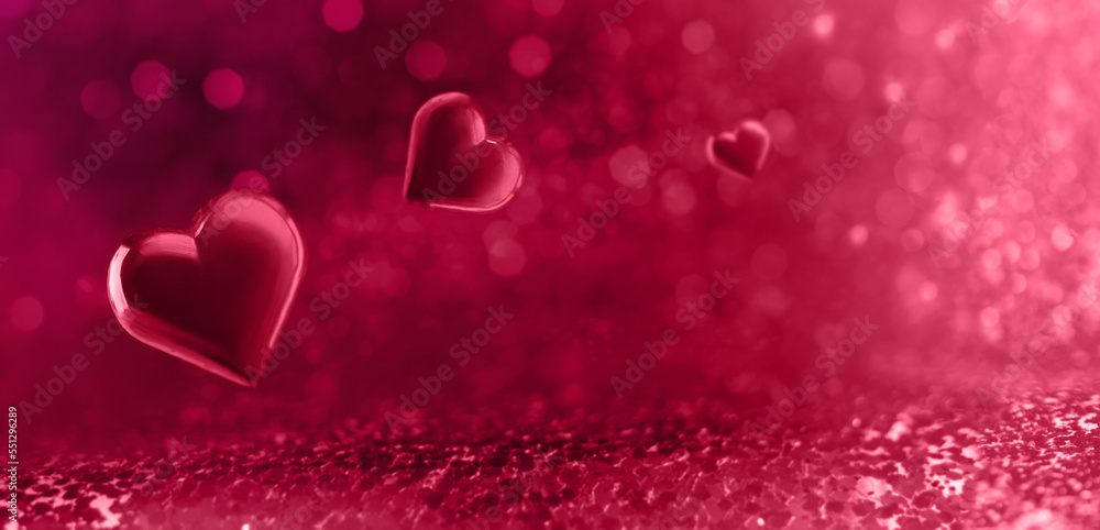 Valentine's day concept with hearts on magenta background with bokeh.
