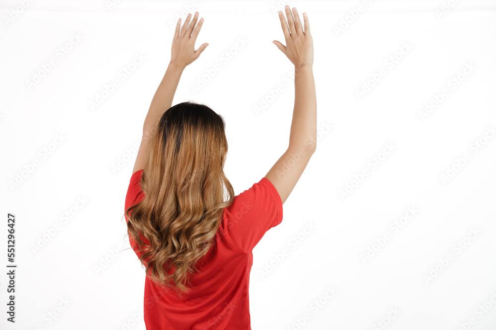Studio shot of female asian soccer fans with red t-shirt isolated on white background. rear or back view Studio shot of female asian soccer fans with red t-shirt isolated on white background. rear or back view