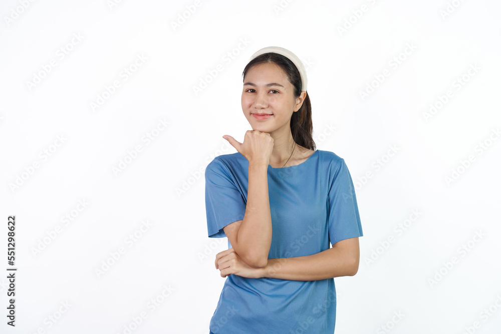 Beautiful Asian woman in blue t-shirt isolated on white background. Hands pointing for advertise or discount Beautiful Asian woman in blue t-shirt isolated on white background. Hands pointing for advertise or discount