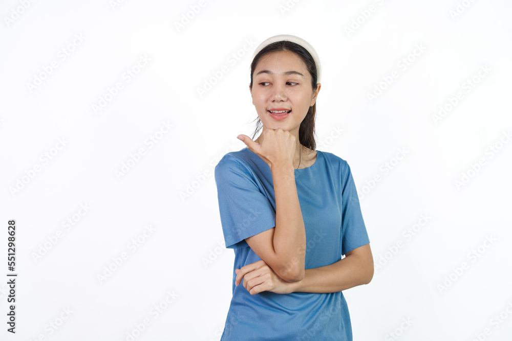 Beautiful Asian woman in blue t-shirt isolated on white background. Hands pointing for advertise or discount Beautiful Asian woman in blue t-shirt isolated on white background. Hands pointing for advertise or discount