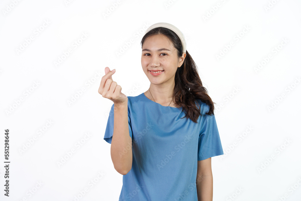 Beautiful Asian woman in blue t-shirt isolated on white background. mini heart Beautiful Asian woman in blue t-shirt isolated on white background. mini heart