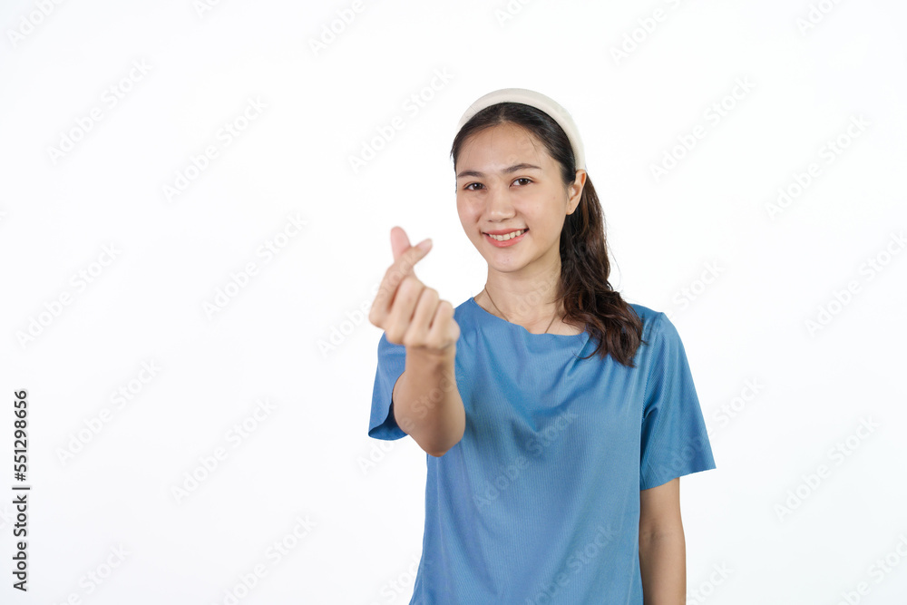 Beautiful Asian woman in blue t-shirt isolated on white background. mini heart Beautiful Asian woman in blue t-shirt isolated on white background. mini heart