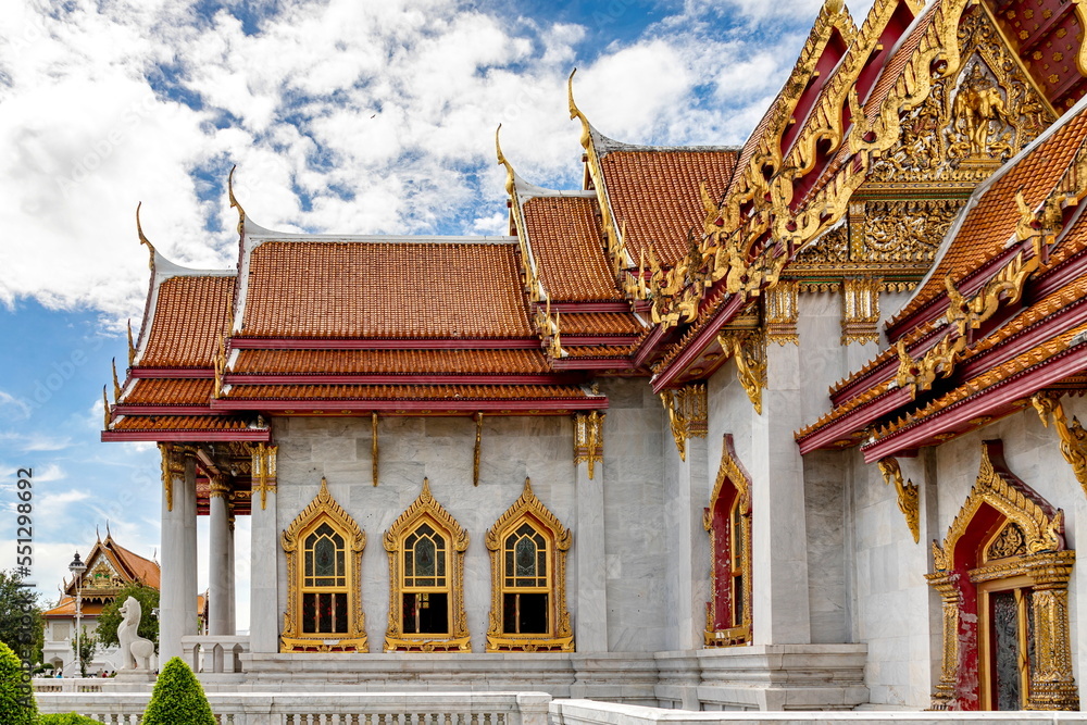 Wat Benchamabophit Dusit Wanaram (This temple is known as the Marble Temple) in Bangkok, blue sky and clouds. One of the most beautiful temples in Thailand Favorite destination in Bangkok. Daytime.