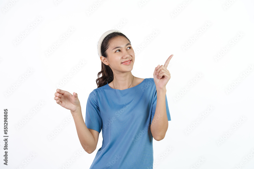 Beautiful Asian woman in blue t-shirt isolated on white background. Holding hands product Beautiful Asian woman in blue t-shirt isolated on white background. Holding hands product