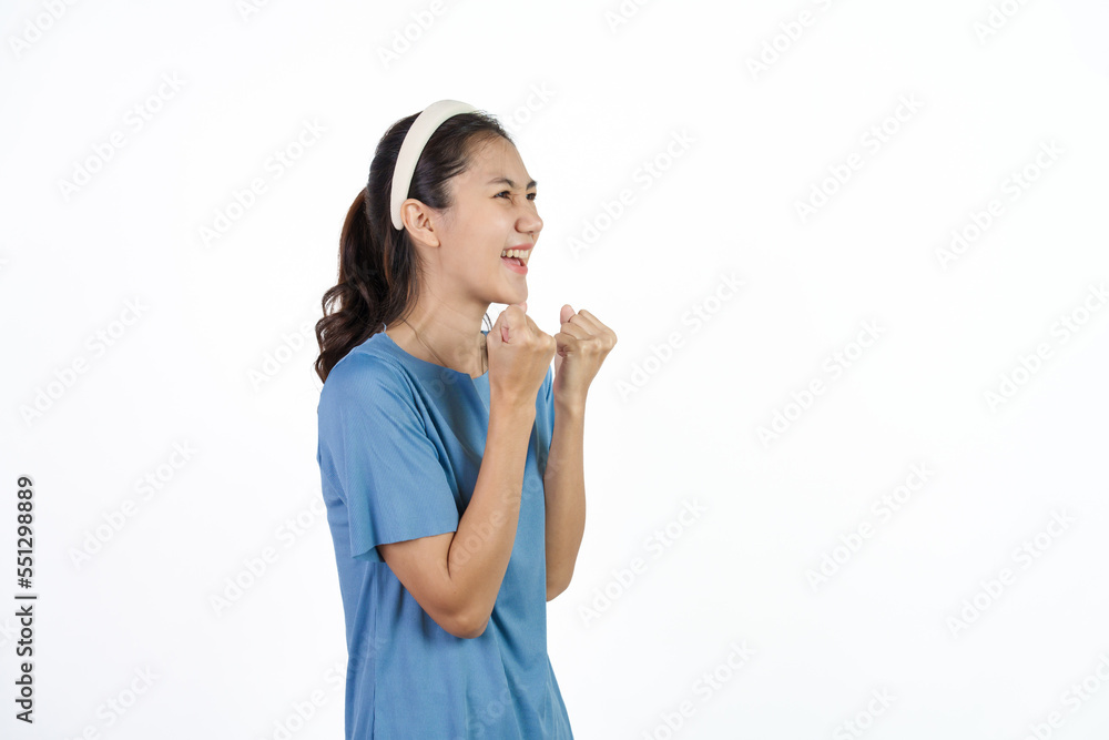 Beautiful Asian woman in blue t-shirt isolated on white background. happy, lucky, win Beautiful Asian woman in blue t-shirt isolated on white background. happy, lucky, win