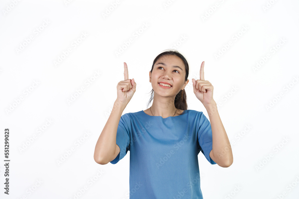 Beautiful Asian woman in blue t-shirt isolated on white background. Pointing hands Beautiful Asian woman in blue t-shirt isolated on white background. Pointing hands