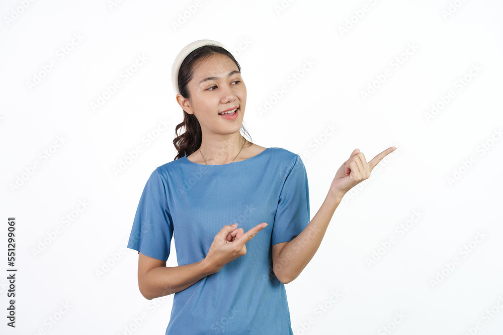 Beautiful Asian woman in blue t-shirt isolated on white background. Pointing hands Beautiful Asian woman in blue t-shirt isolated on white background. Pointing hands