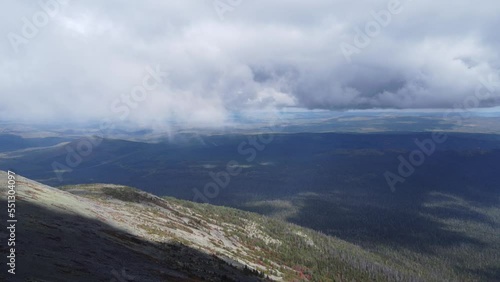 Flying over a flat surface in the mountains