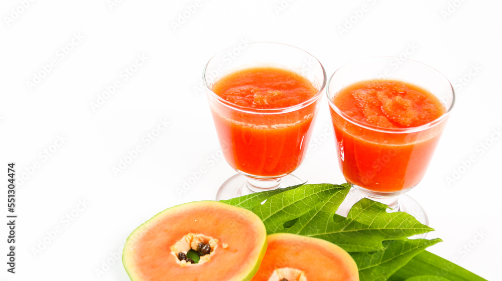 Papaya smoothie in glass jar and glasses on white background diet vegetarian healthy and freshness drink concept soft and selective focus Papaya smoothie in glass jar and glasses on white background diet vegetarian healthy and freshness drink concept soft and selective focus