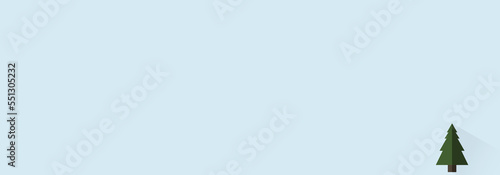 Little Christmas tree with shadow on light blue background