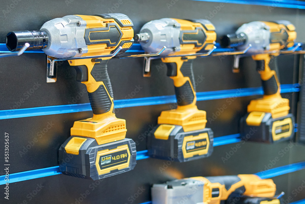 A professional tool for work, repair and construction in the store. Sale of wired power tools and battery powered equipment in the shop A professional tool for work, repair and construction in the store. Sale of wired power tools and battery powered equipment in the shop