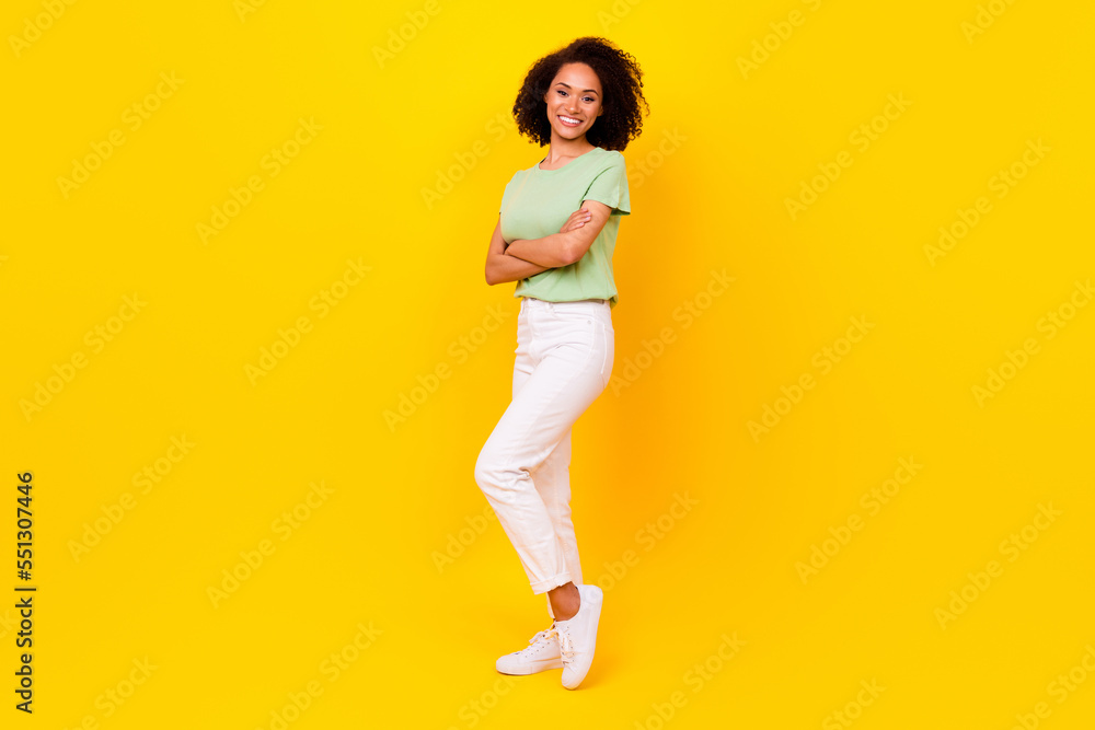 Full length photo of young adorable gorgeous nice pretty woman wear casual stylish clothes folded hands toothy beaming successful isolated on yellow color background Full length photo of young adorable gorgeous nice pretty woman wear casual stylish clothes folded hands toothy beaming successful isolated on yellow color background