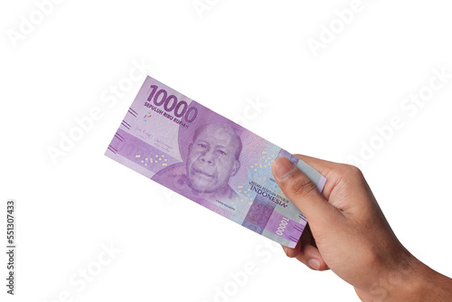 Hand holding ten thousand rupiah note isolated on white background photo