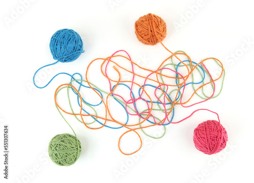 Colorful cotton thread balls isolated on white background. Set of four color (orange, pink, grey, green, blue) thread balls..