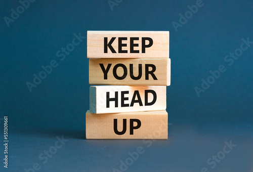Keep your head up symbol. Concept words Keep your head up on wooden cubes. Beautiful grey table grey background. Business motivational keep your head up concept. Copy space.