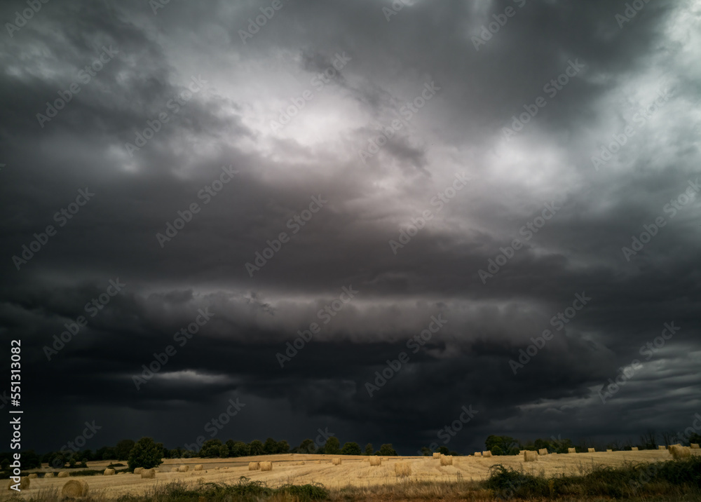 Dark stormy clouds over the wheat crop Dark stormy clouds over the wheat crop
