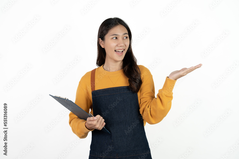 Happy young asian woman business owner wear apron and holding digital tablet for checking order from customer isolated on white background for SME franchise investment concept. Happy young asian woman business owner wear apron and holding digital tablet for checking order from customer isolated on white background for SME franchise investment concept.