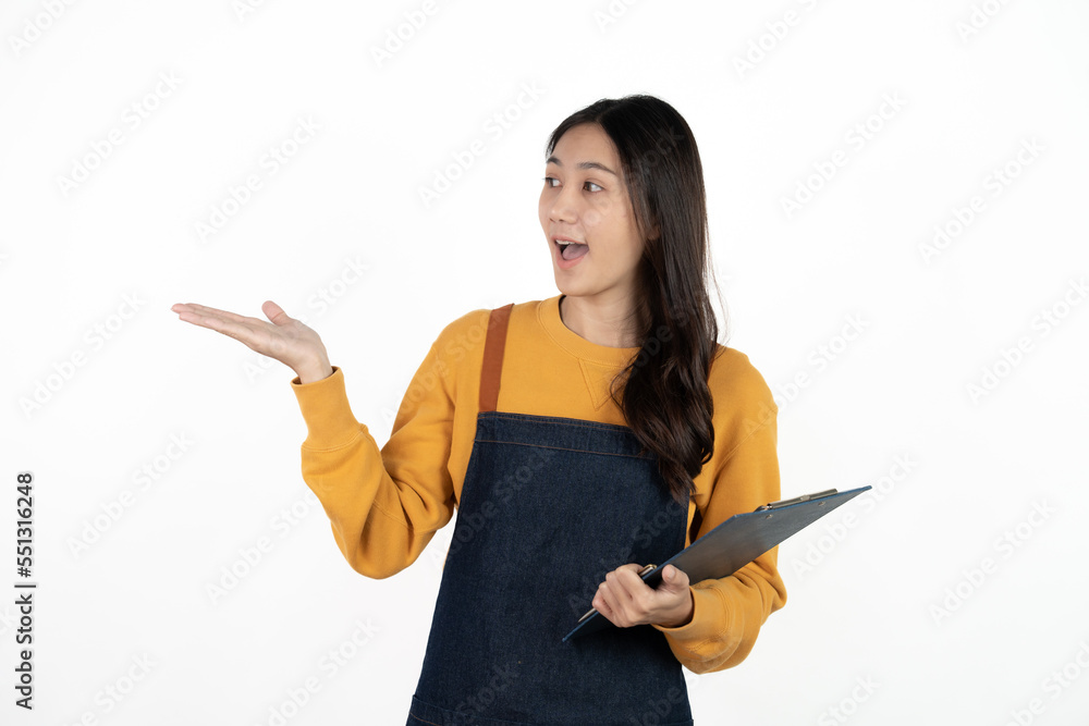 Happy young asian woman business owner wear apron and holding digital tablet for checking order from customer isolated on white background for SME franchise investment concept. Happy young asian woman business owner wear apron and holding digital tablet for checking order from customer isolated on white background for SME franchise investment concept.