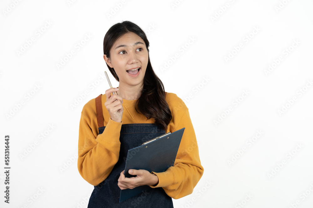 Happy young asian woman business owner wear apron and holding digital tablet for checking order from customer isolated on white background for SME franchise investment concept. Happy young asian woman business owner wear apron and holding digital tablet for checking order from customer isolated on white background for SME franchise investment concept.