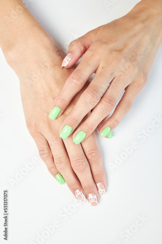 female manicure on a white background. nail. nails. Women s hands with a beautiful manicure on a white background. Beautiful female hands on a light background. Take care of your hand.