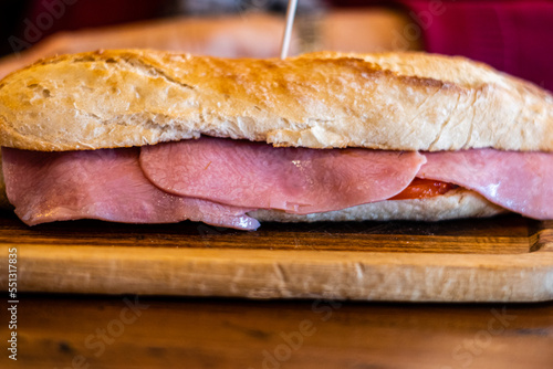 Close up, York ham on a sandwich, on a wooden table