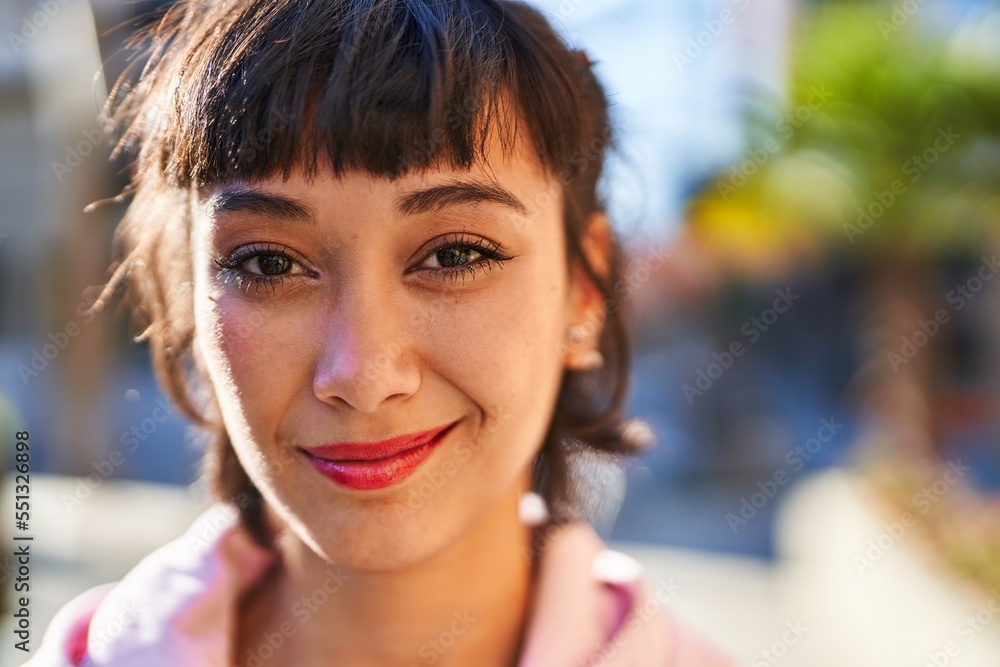 Young woman smiling confident standing at street Young woman smiling confident standing at street