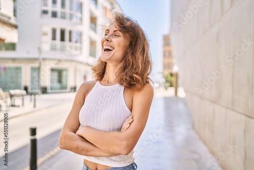 Young caucasian woman smiling confident at street