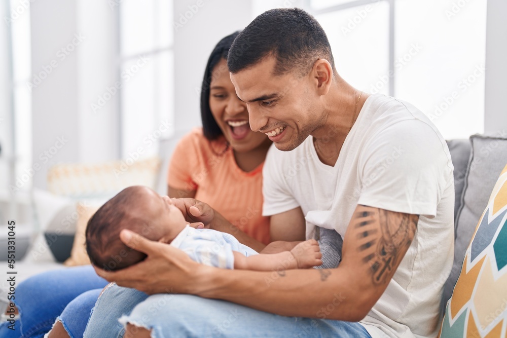 Hispanic family smiling confident sitting on sofa at home Hispanic family smiling confident sitting on sofa at home
