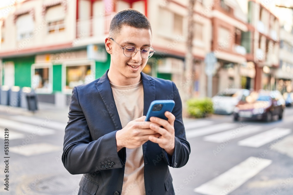 Young hispanic man executive smiling confident using smartphone at street Young hispanic man executive smiling confident using smartphone at street