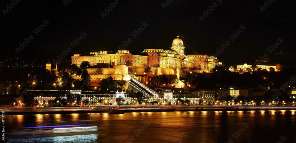 Night shot, long exposure photography, famous historical Buda Castle in illuminated at night, Royal Palace view by the Danube river, Budapest, Hungary