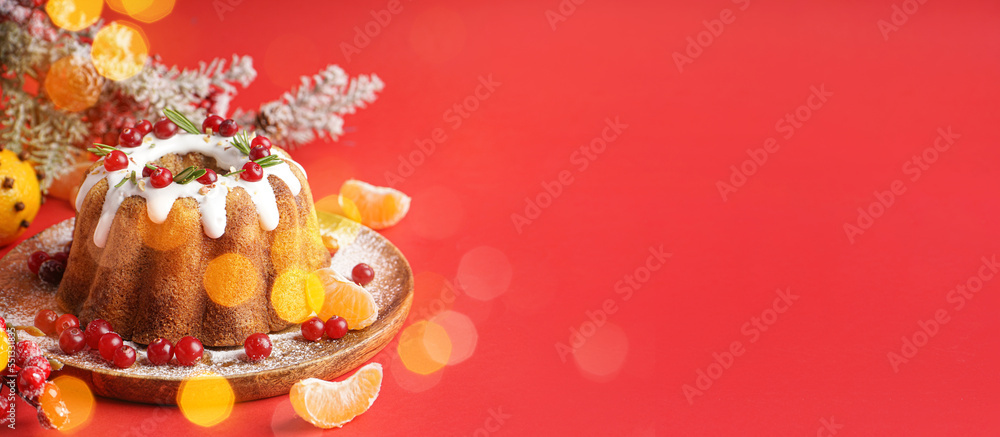 Tasty Christmas cake and decor on red background with space for text