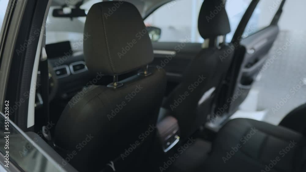View of the car interior, seats, head restraints, seat belt. Slow motion from inside the car View of the car interior, seats, head restraints, seat belt. Slow motion from inside the car