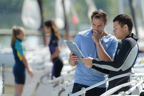 Fototapeta Naklejka Na Ścianę i Meble -  a sports teacher with student