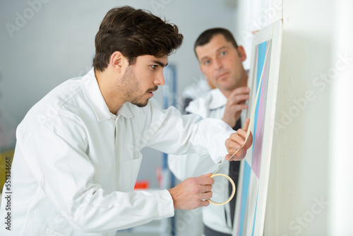 young apprentice painter in professional training