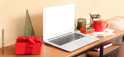 Laptop with Christmas prese...