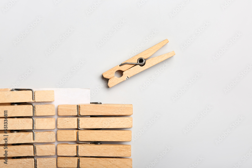 Wooden clothespins on white background, closeup Wooden clothespins on white background, closeup