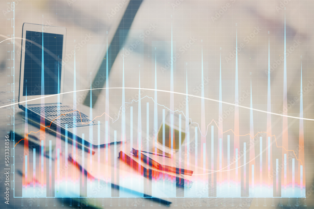 Forex Chart hologram on table with computer background. Multi exposure. Concept of financial markets. Forex Chart hologram on table with computer background. Multi exposure. Concept of financial markets.