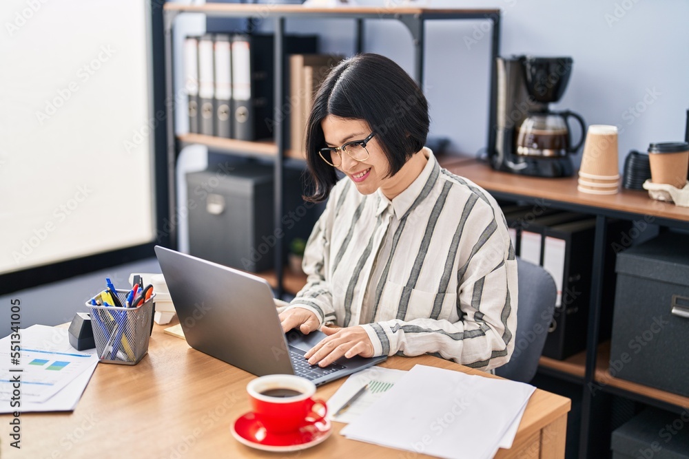 Young chinese woman business worker using laptop working at office Young chinese woman business worker using laptop working at office